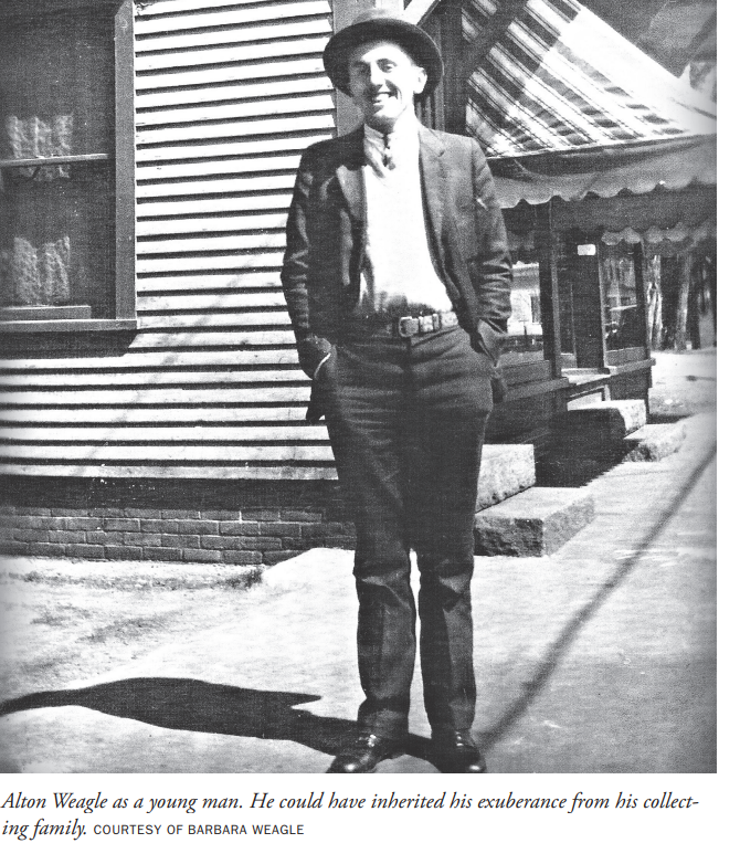 Alton Weagle as a young man, hands in pockets, standing on a small-town sidewalk in a jacket and boots.